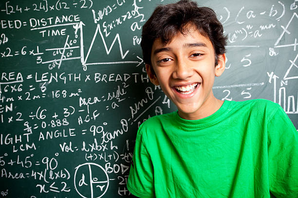 Cheerful Indian Boy/Student with Mathematics Problems